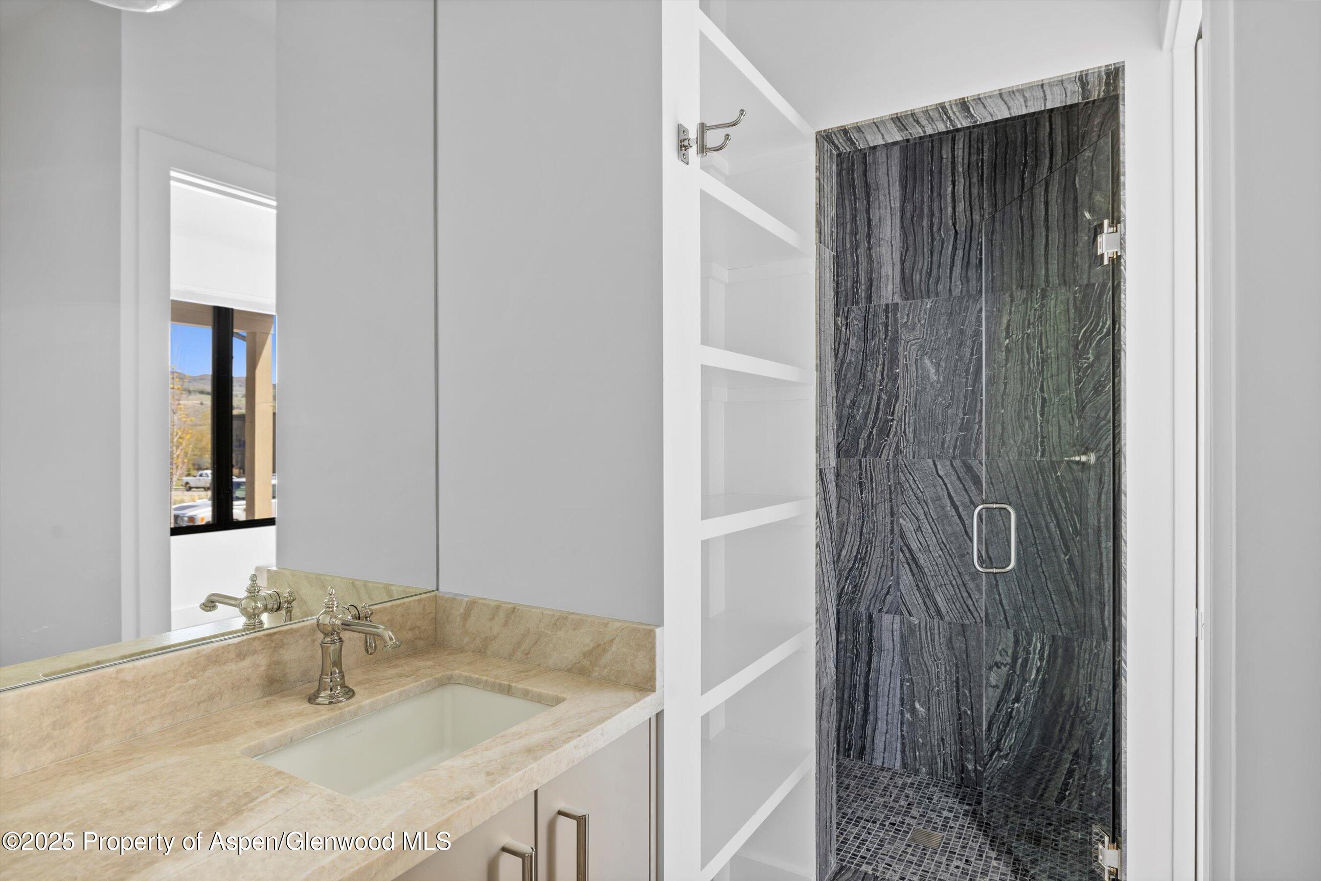 337 Stotts Mill Road Basalt, CO 81621 - Photo 13 of 24 a bathroom with a granite countertop shower and a sink