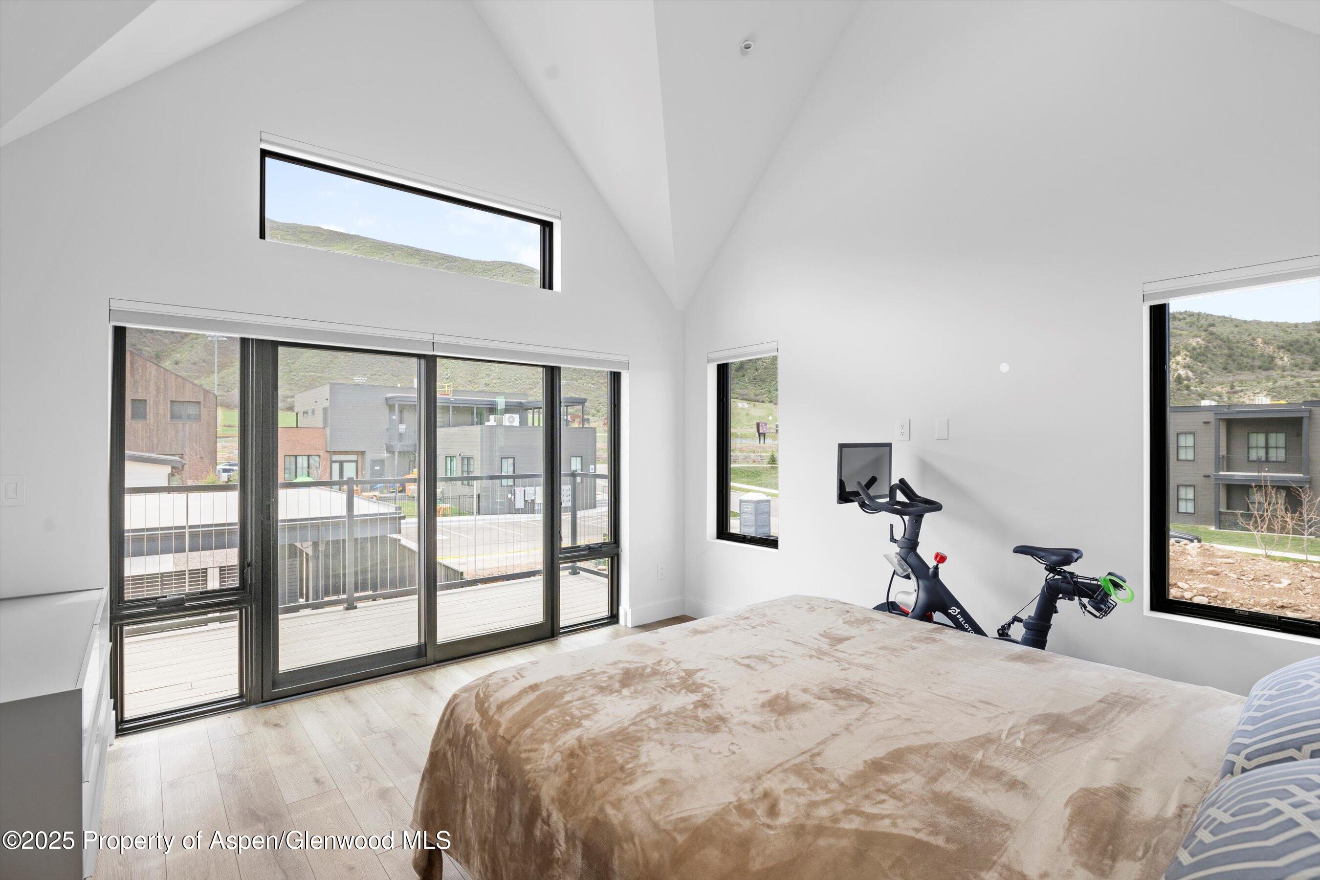 337 Stotts Mill Road Basalt, CO 81621 - Photo 6 of 24 a bedroom with a bed and a large window with outer view