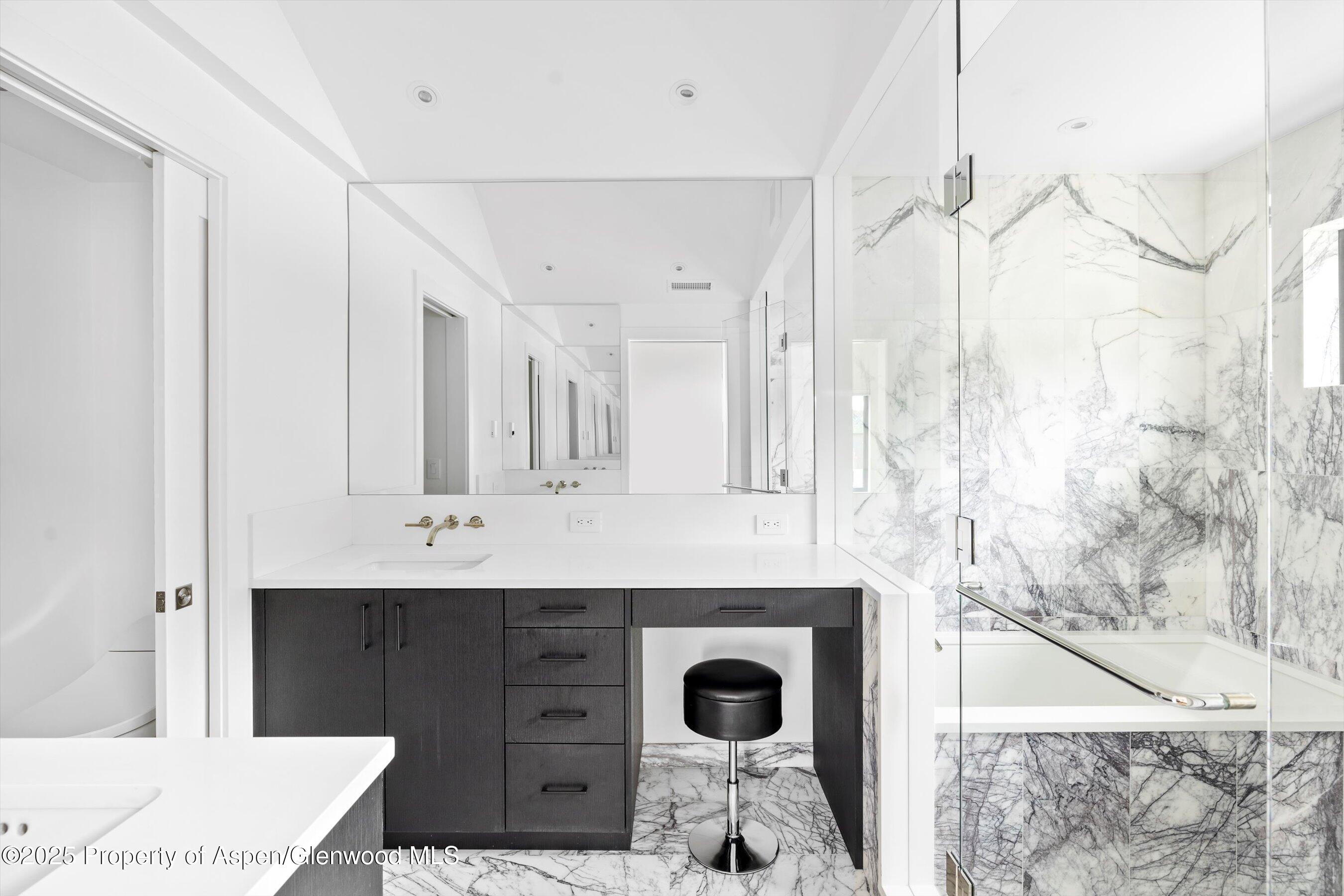 337 Stotts Mill Road Basalt, CO 81621 - Photo 7 of 24 a bathroom with a sink vanity granite tub and shower