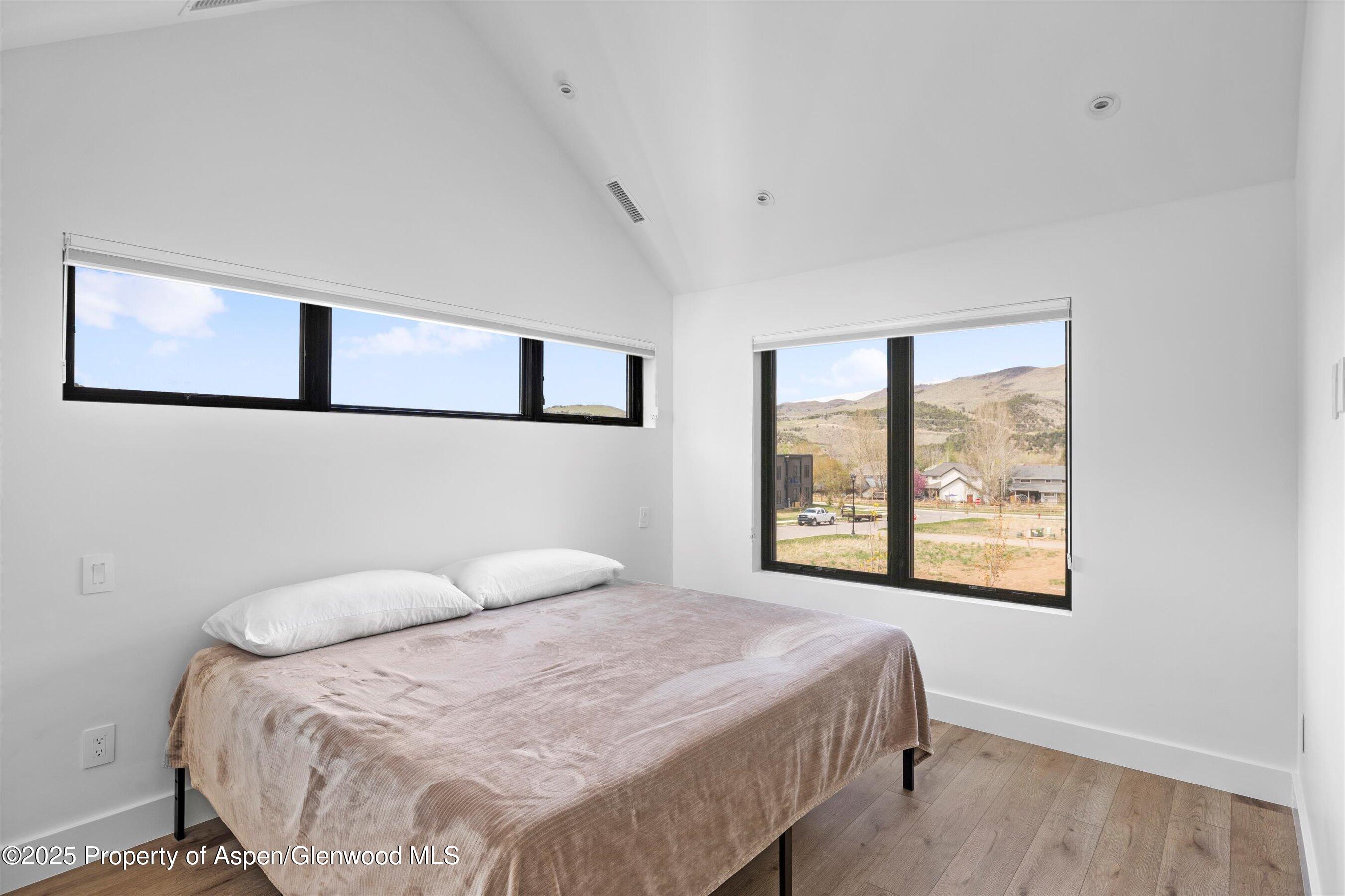 337 Stotts Mill Road Basalt, CO 81621 - Photo 8 of 24 a bedroom with a bed and a window