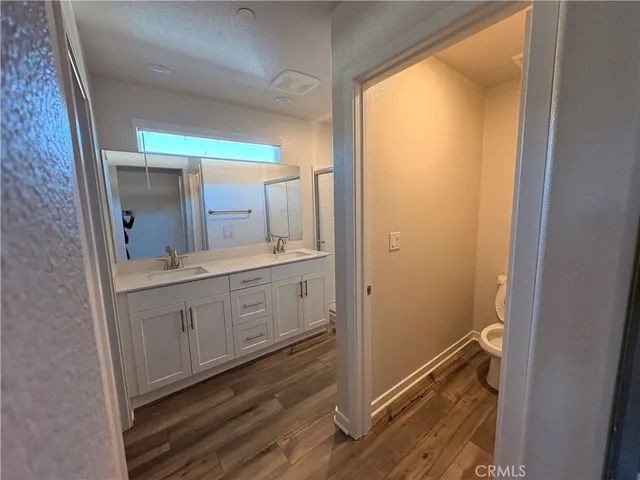 a spacious bathroom with a mirror and a shower