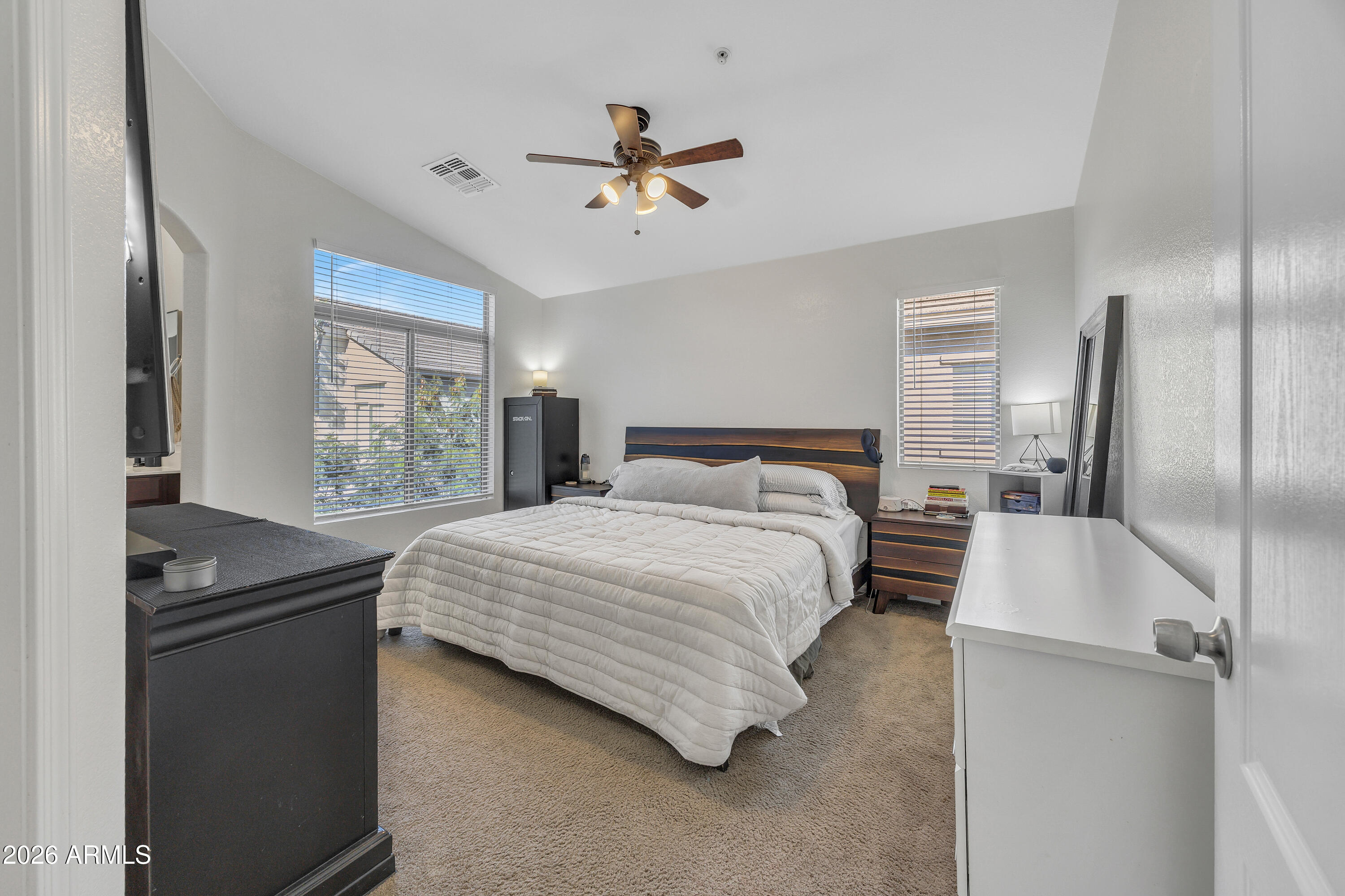 280 South Evergreen Road, Unit 1263 Tempe, AZ 85288 - Photo 12 of 32 a bedroom with a large bed and a chandelier