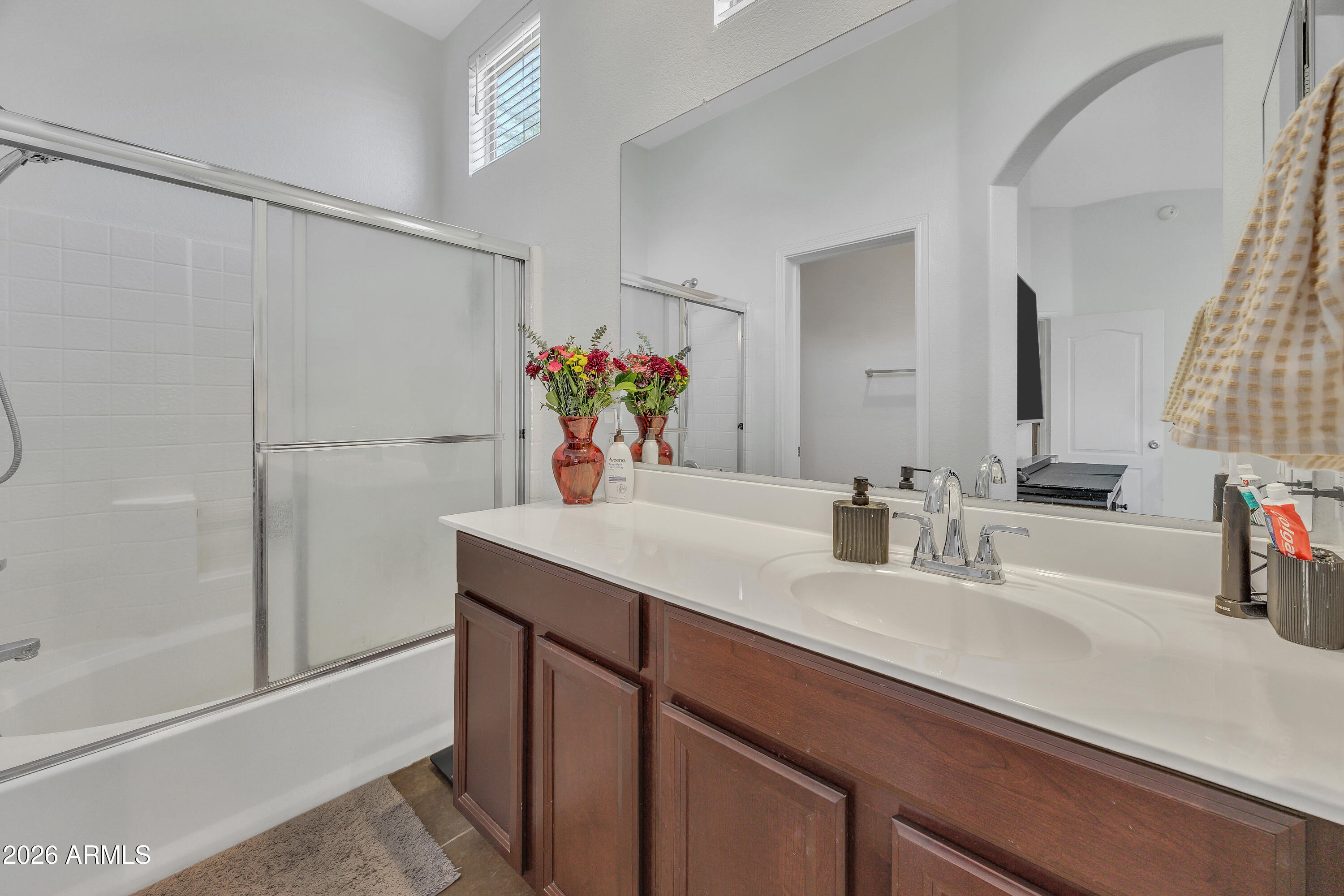 280 South Evergreen Road, Unit 1263 Tempe, AZ 85288 - Photo 13 of 32 a bathroom with a sink and a mirror