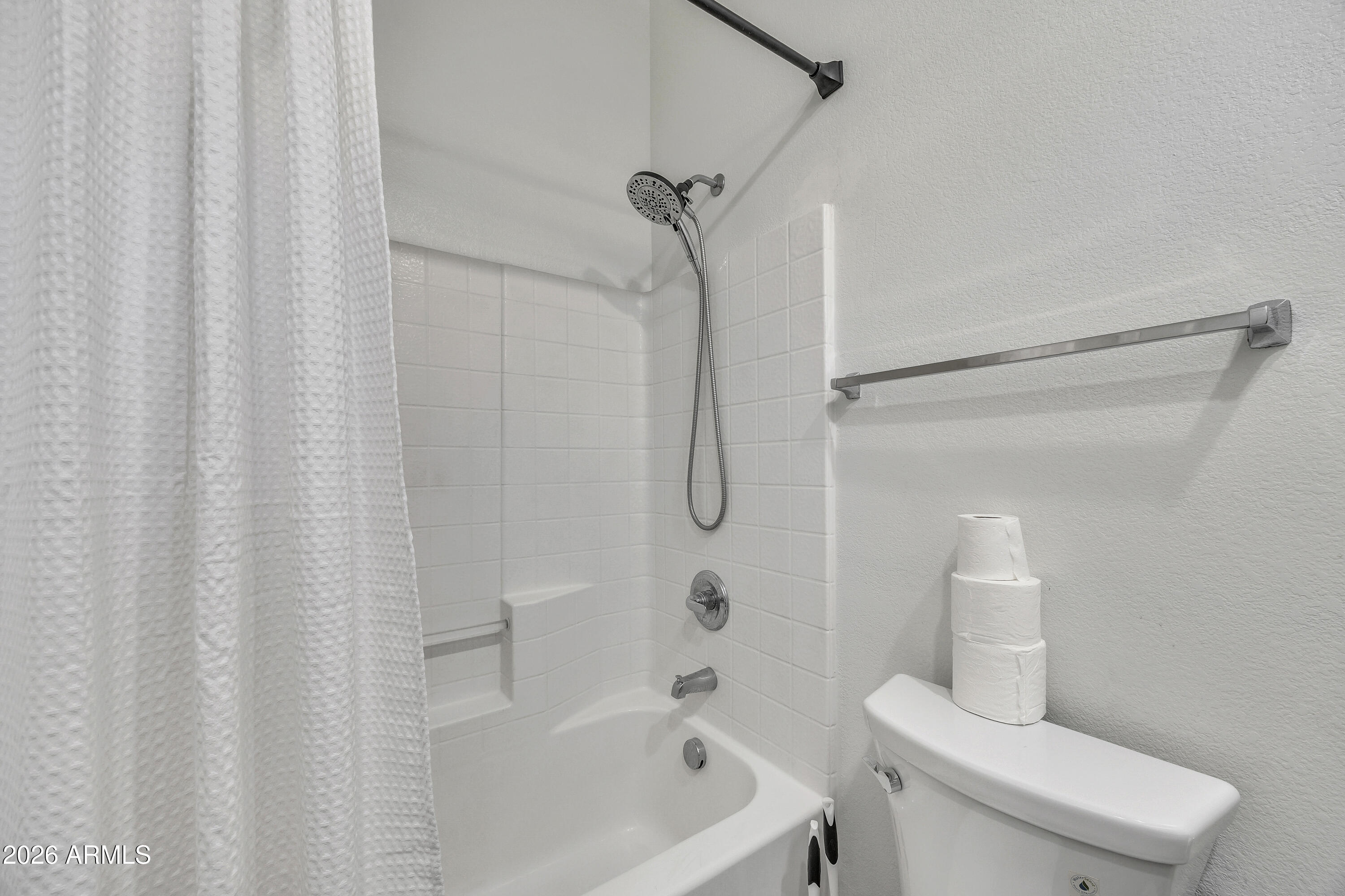 280 South Evergreen Road, Unit 1263 Tempe, AZ 85288 - Photo 17 of 32 a bathroom with a toilet and shower
