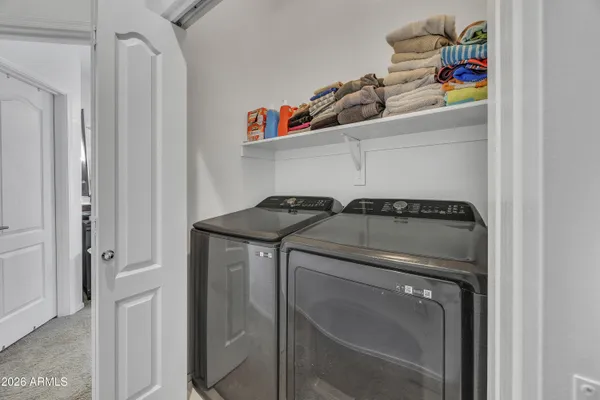 a utility room with dryer and washer