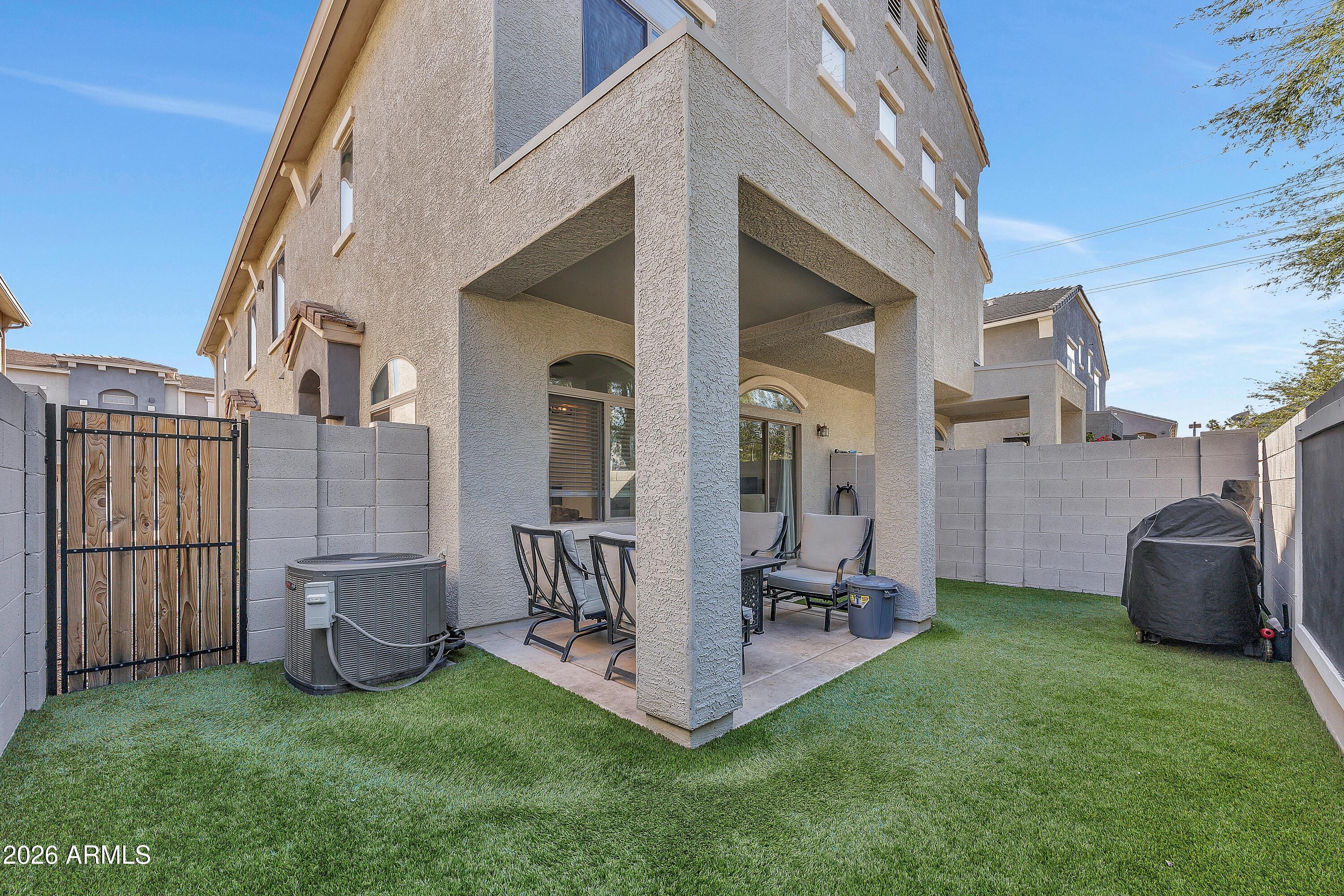 280 South Evergreen Road, Unit 1263 Tempe, AZ 85288 - Photo 20 of 32 a view of a patio with furniture and a yard