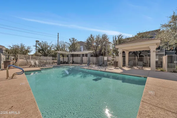 a view of a swimming pool with a patio