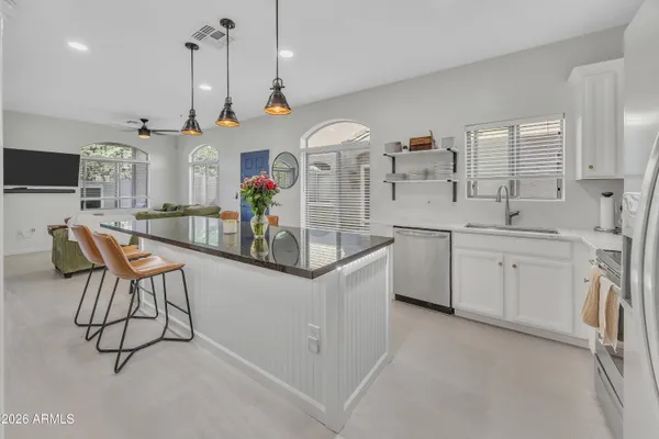 a view of a kitchen and microwave