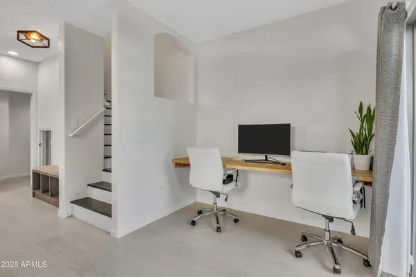 a room with furniture and white walls