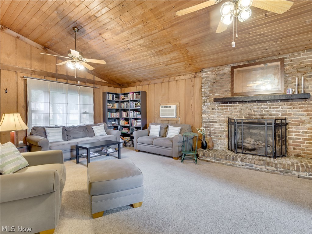 2983 Littledale Road Akron, OH 44319 - Photo 11 of 27 As you move into the expansive family room, you are welcomed with vaulted ceilings and a gorgeous gas fireplace with brick surround.
