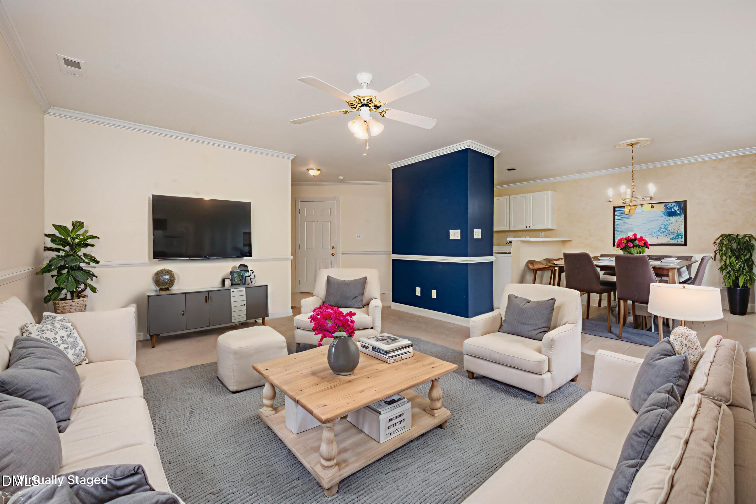 118 Grande Meadow Way Cary, NC 27513 - Photo 10 of 33 a living room with furniture kitchen view and a flat screen tv