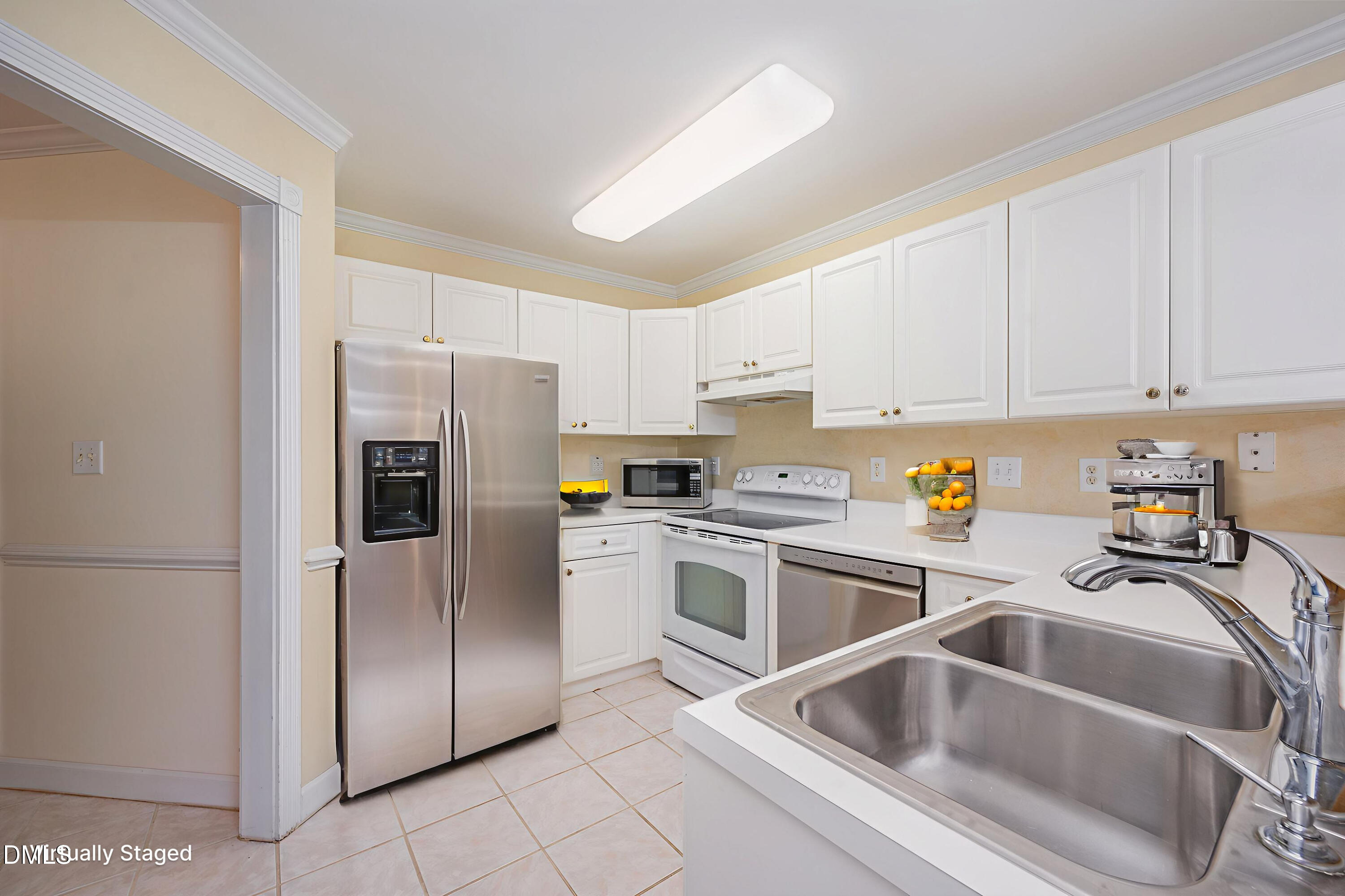 118 Grande Meadow Way Cary, NC 27513 - Photo 15 of 33 a kitchen with a refrigerator sink and white cabinets