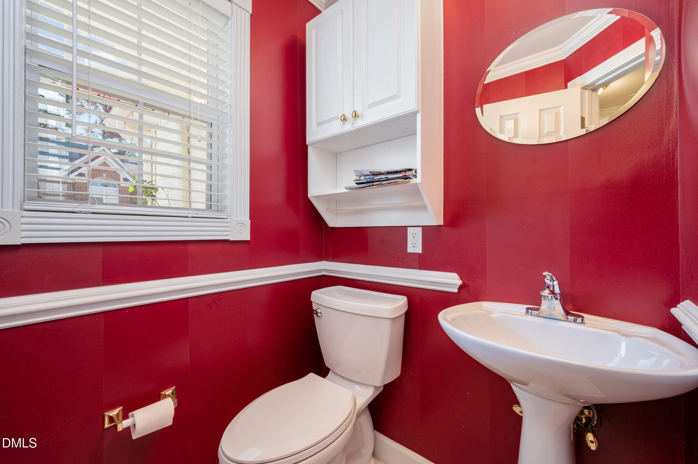 118 Grande Meadow Way Cary, NC 27513 - Photo 18 of 33 a bathroom with a sink a mirror and a toilet
