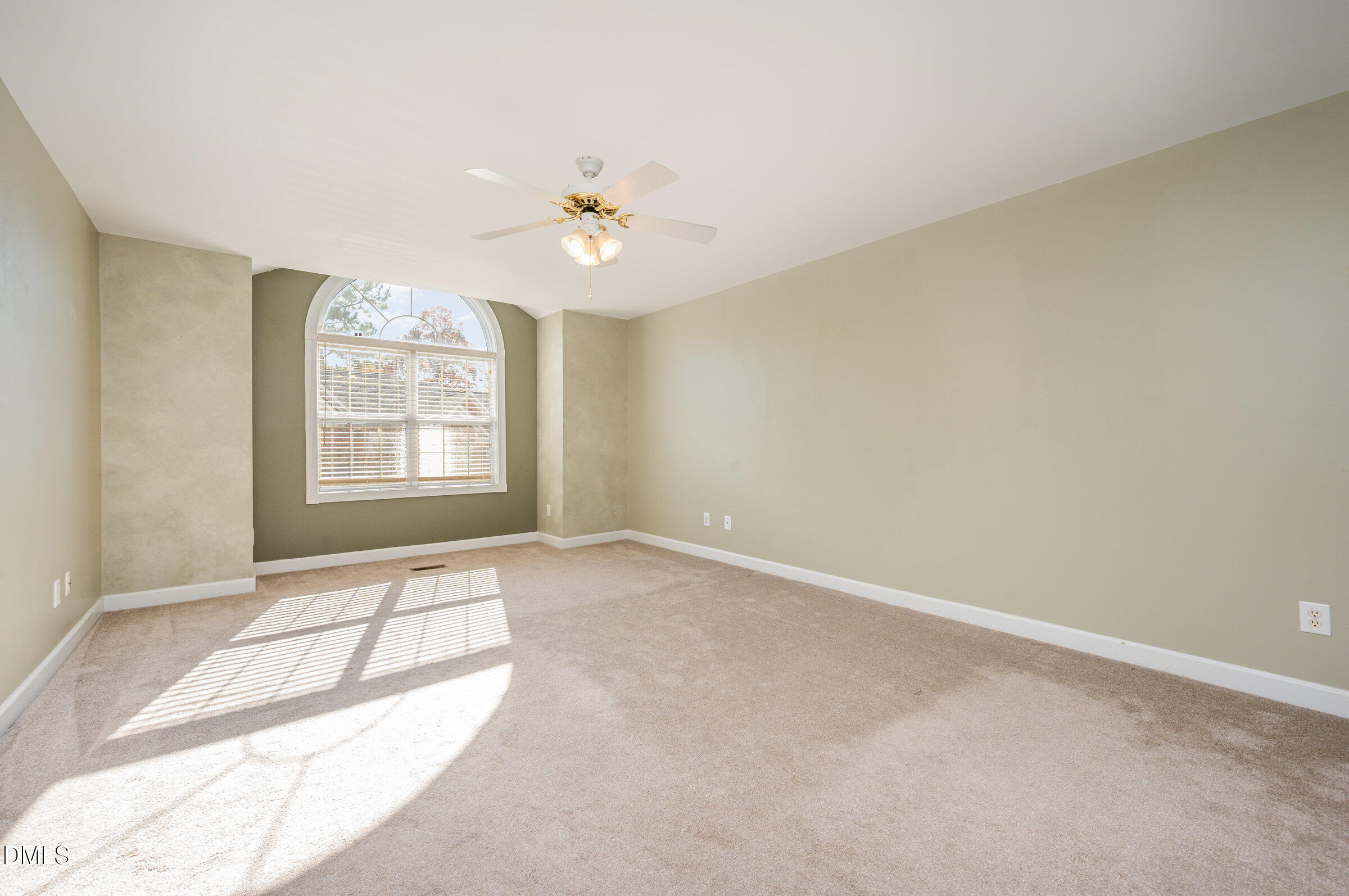 118 Grande Meadow Way Cary, NC 27513 - Photo 19 of 33 an empty room with windows and ceiling fan