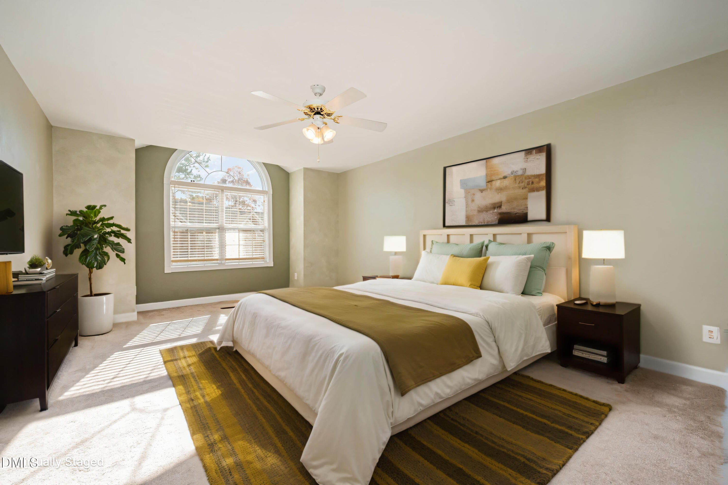 118 Grande Meadow Way Cary, NC 27513 - Photo 20 of 33 a spacious bedroom with a bed and a chandelier