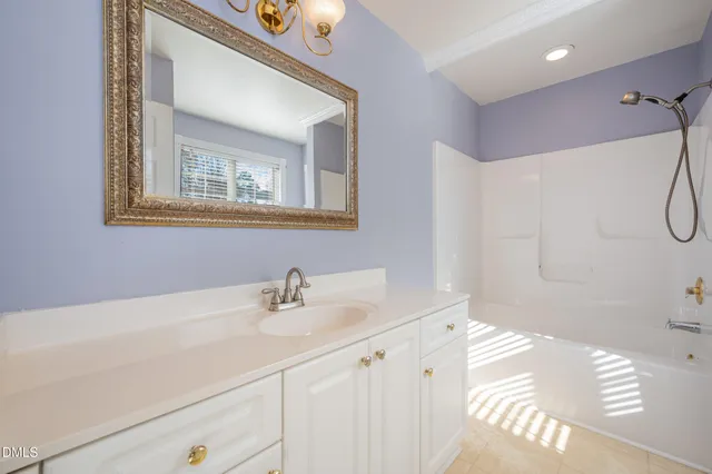 a bathroom with a sink a vanity and a mirror