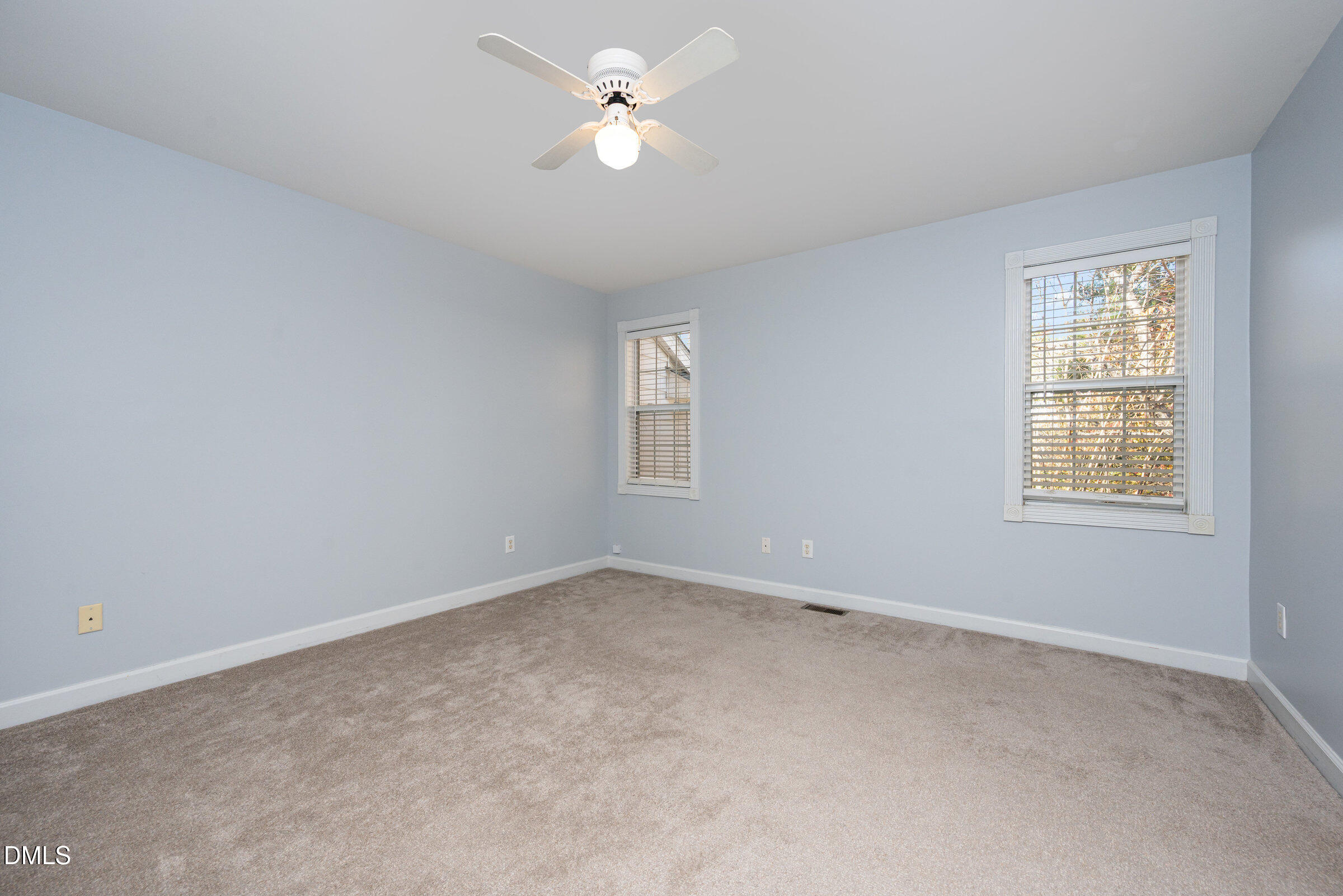 118 Grande Meadow Way Cary, NC 27513 - Photo 24 of 33 an empty room with a window and a ceiling fan