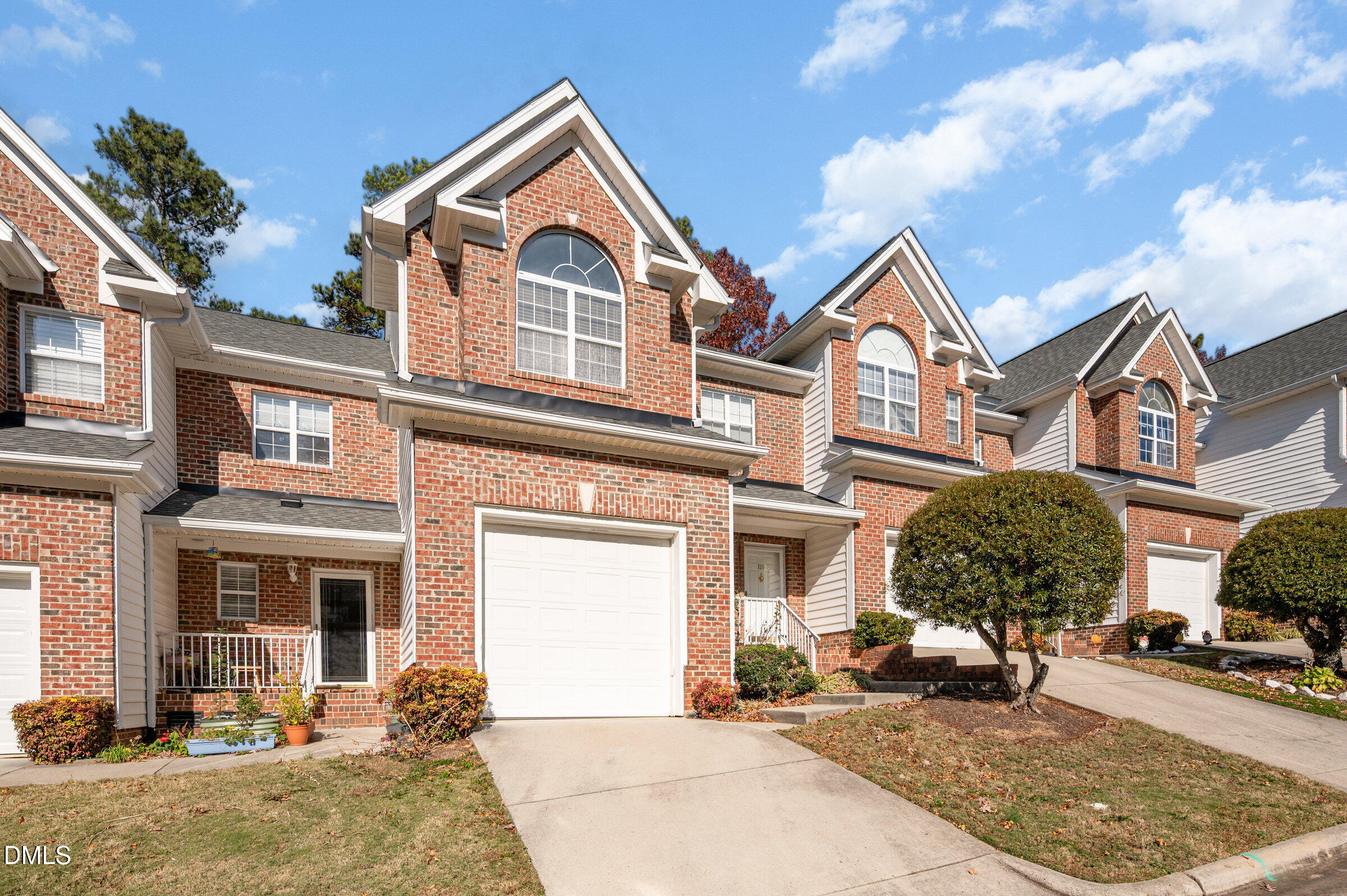 118 Grande Meadow Way Cary, NC 27513 - Photo 3 of 33 a front view of a house with garden