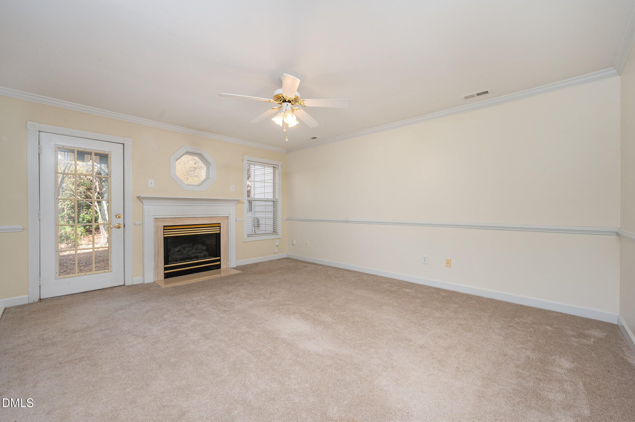 118 Grande Meadow Way Cary, NC 27513 - Photo 7 of 33 a view of empty room with fan and fireplace