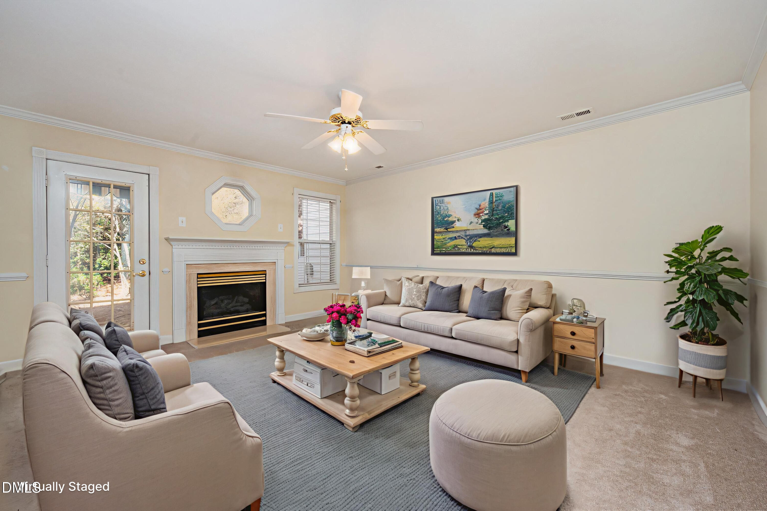 118 Grande Meadow Way Cary, NC 27513 - Photo 8 of 33 a living room with furniture a fireplace and a large mirror