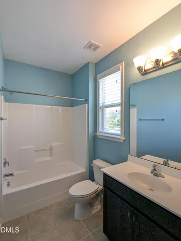 a bathroom with a sink double vanity and a mirror