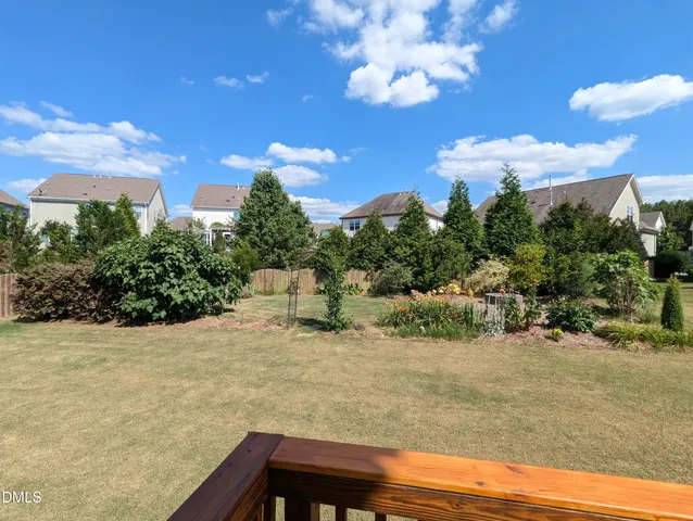 a wooden bench with view of trees