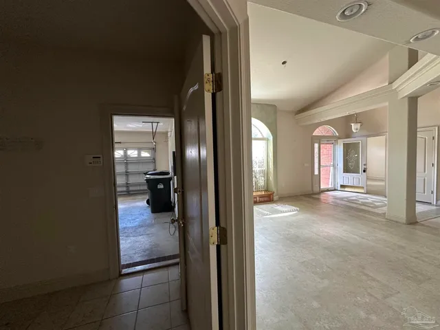 a bathroom with a double vanity sink a mirror a bathtub and shower