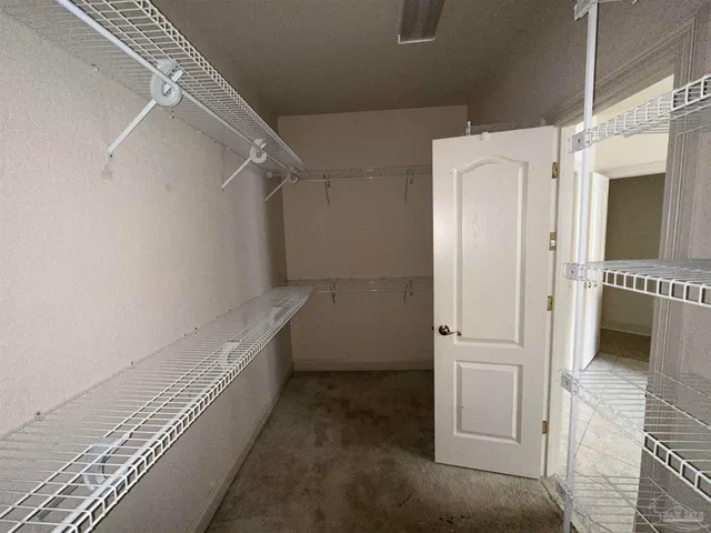 a bath tub sitting in a bathroom next to a window