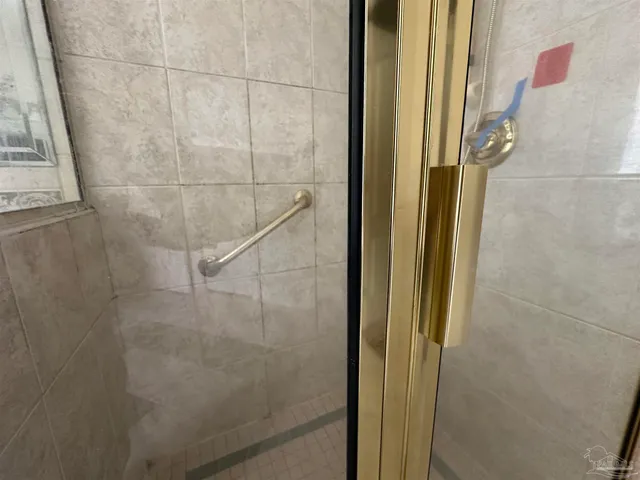 a bathroom with a sink and a large mirror