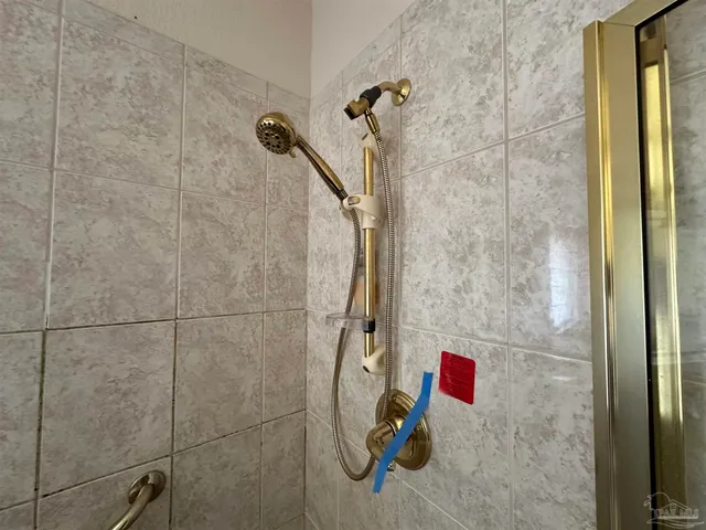 a bathroom with a sink a bathtub and a vanity
