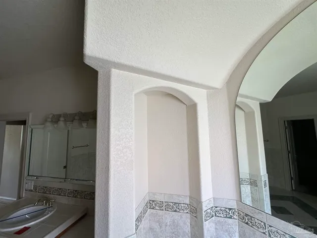 a house view with swimming pool in front of it