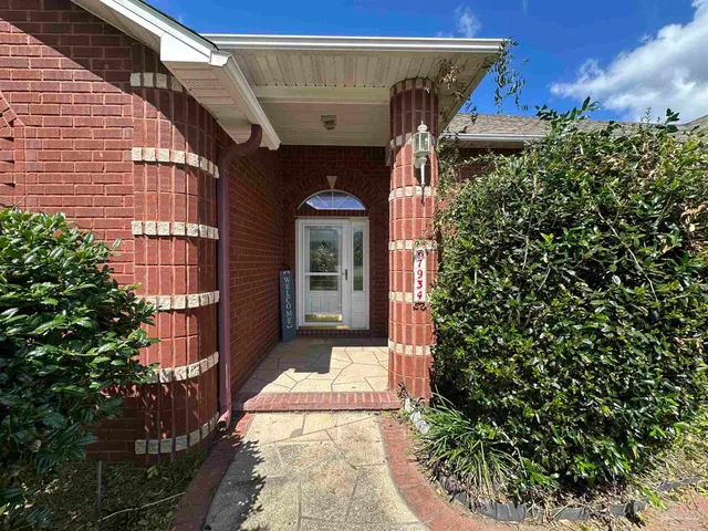 a kitchen with wooden cabinets and a stove top oven