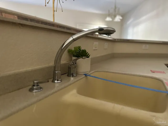 an empty room with a ceiling fan and a window