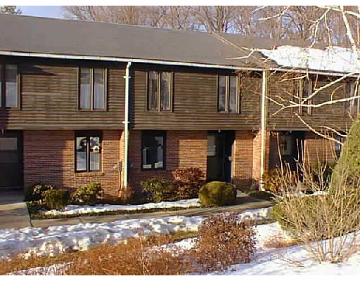 10 Emerson Court, Unit 10B Amherst, MA 01002 - Photo 1 of 1 a front view of a house with basket ball court