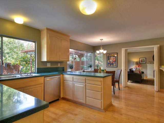 766 Rustic Lane Mountain View, CA 94040 - Photo 11 of 23 a kitchen with lots of counter top space and living room