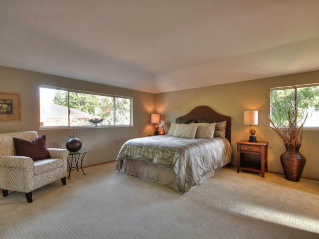 766 Rustic Lane Mountain View, CA 94040 - Photo 15 of 23 a bedroom with bed and glass window