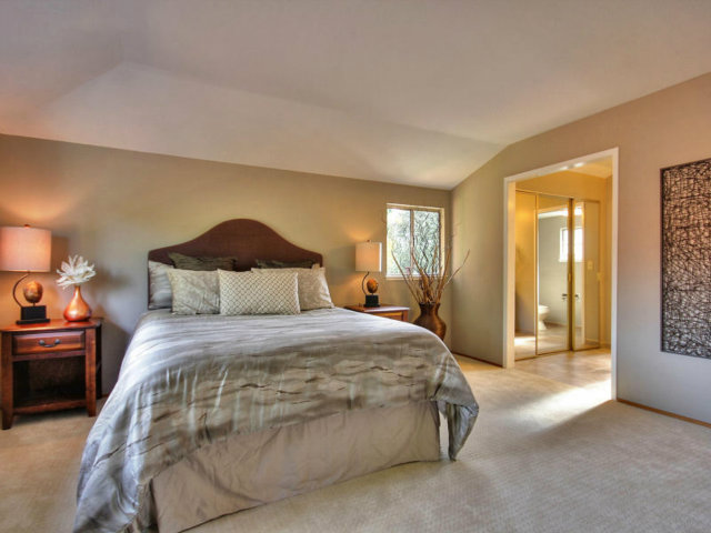 766 Rustic Lane Mountain View, CA 94040 - Photo 16 of 23 a spacious bedroom with a bed and a lamp