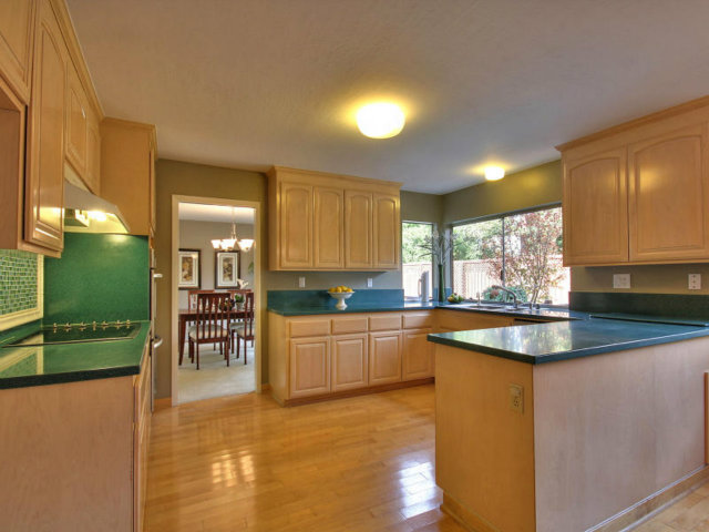 766 Rustic Lane Mountain View, CA 94040 - Photo 9 of 23 a kitchen with kitchen island granite countertop a sink and a stove top oven