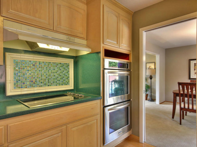 766 Rustic Lane Mountain View, CA 94040 - Photo 10 of 23 a kitchen with stainless steel appliances granite countertop a refrigerator and cabinets