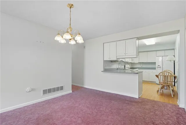 a view of a kitchen with a sink