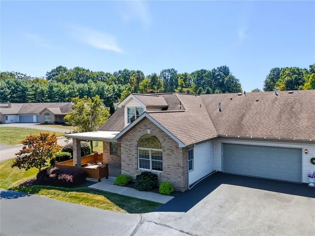 a aerial view of a house with a yard