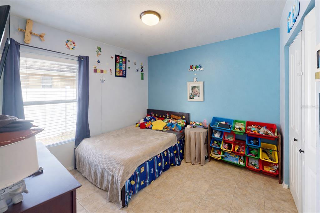 4354 Fieldview Circle Wesley Chapel, FL 33545 - Photo 11 of 15 a bedroom with bed and a window