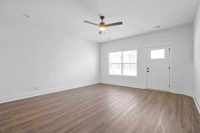 a view of kitchen with wooden floor