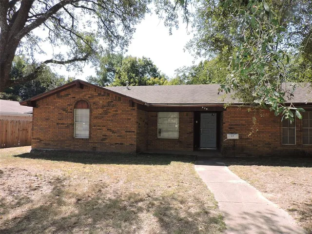 a house with trees in the background