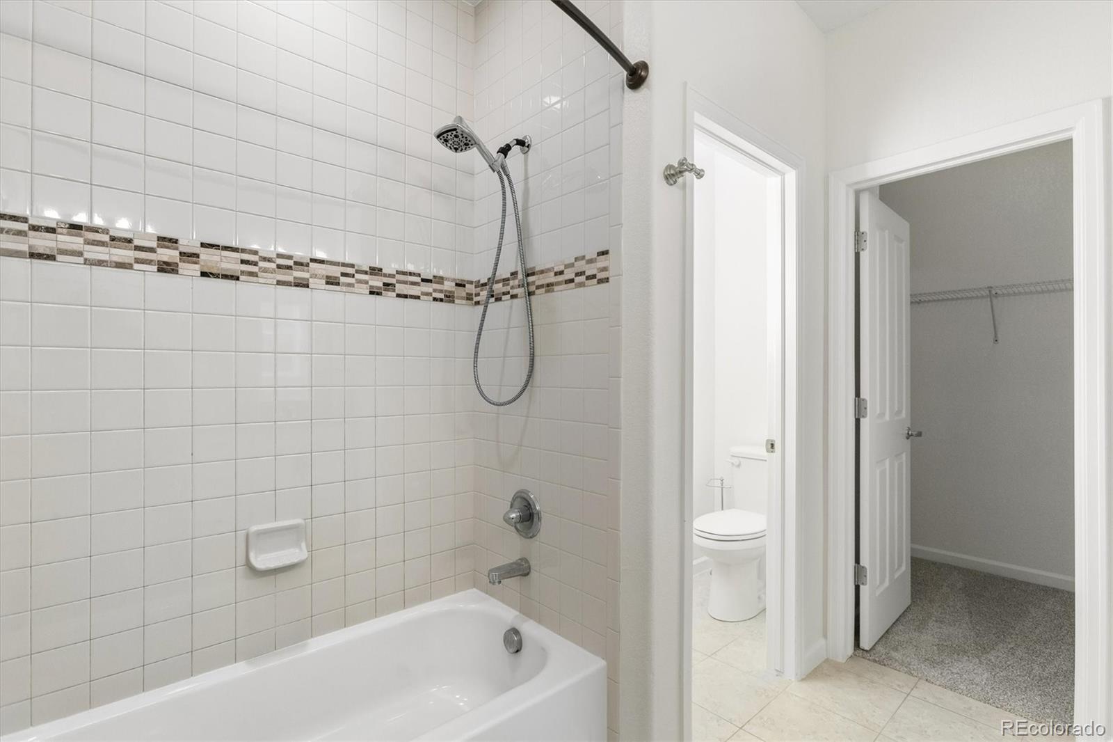 960 Fire Rock Place Colorado Springs, CO 80921 - Photo 15 of 32 a bathroom with a shower a bathtub and a shower