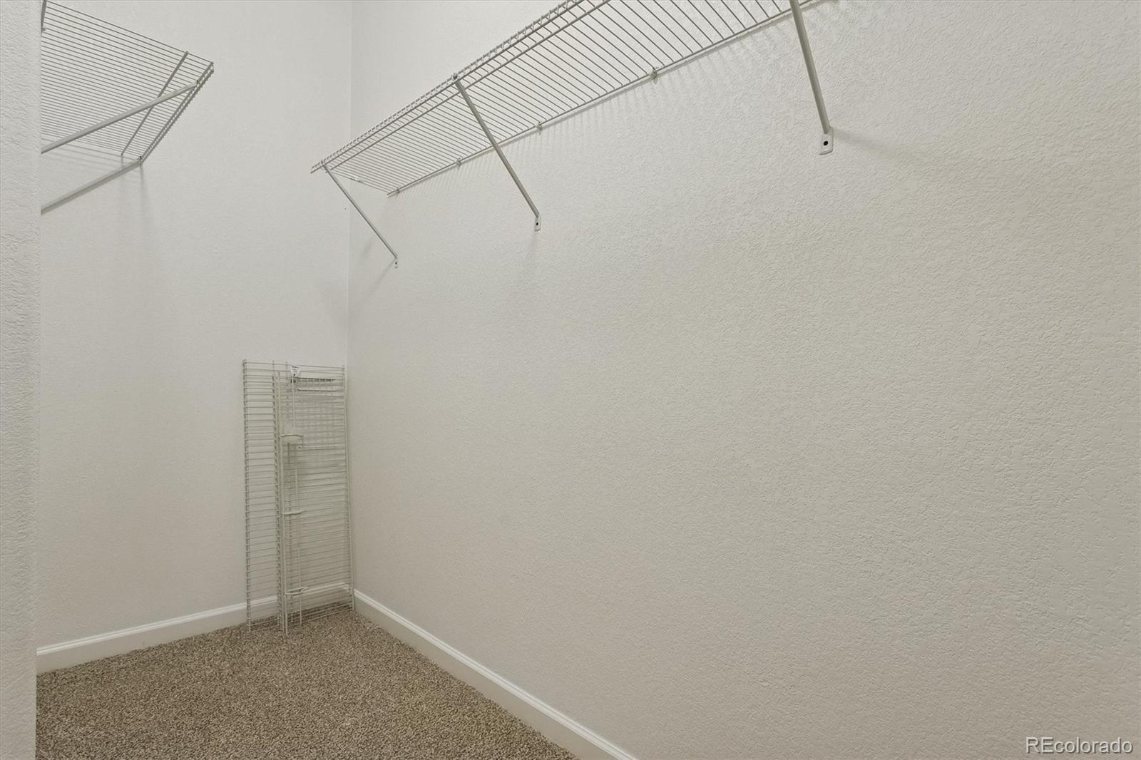 960 Fire Rock Place Colorado Springs, CO 80921 - Photo 16 of 32 a view of a room with racks on the wall