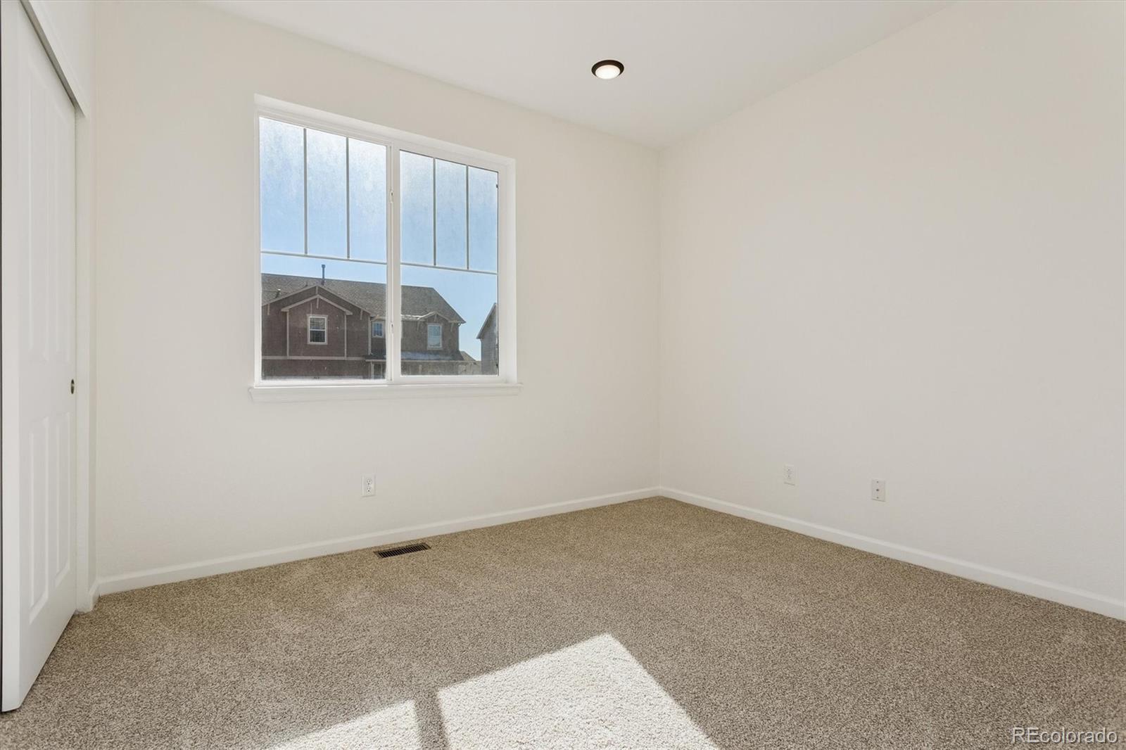 960 Fire Rock Place Colorado Springs, CO 80921 - Photo 18 of 32 an empty room with a window