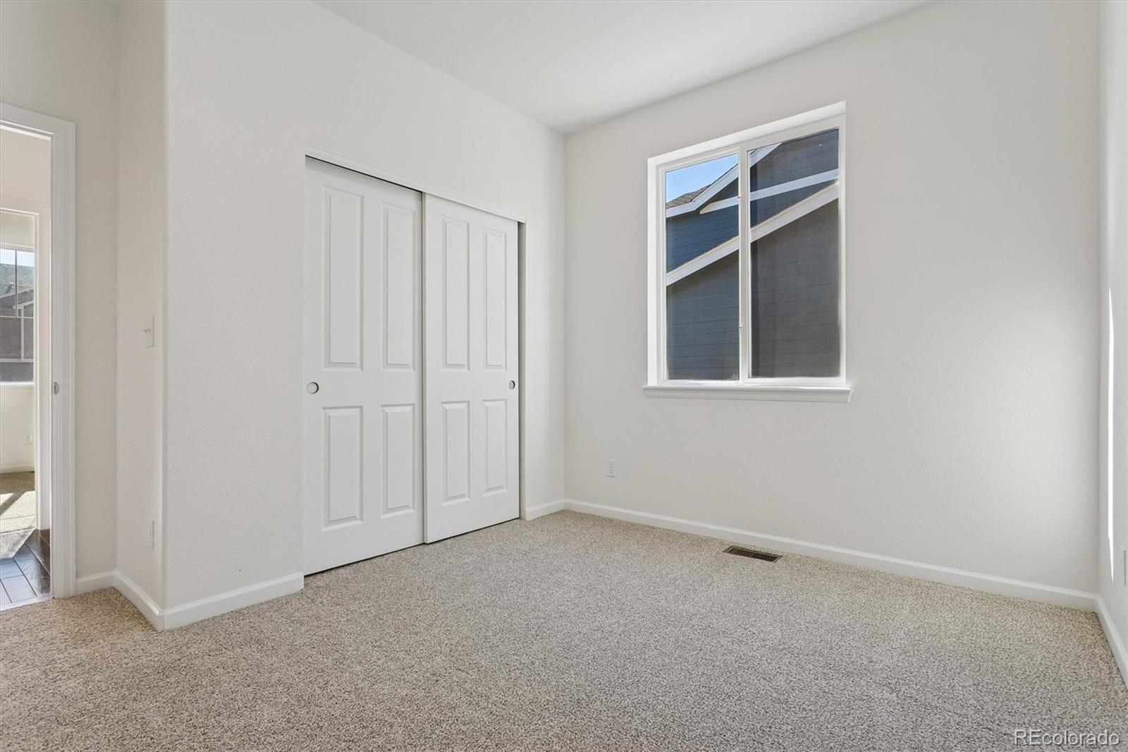 960 Fire Rock Place Colorado Springs, CO 80921 - Photo 19 of 32 a view of an empty room with a window