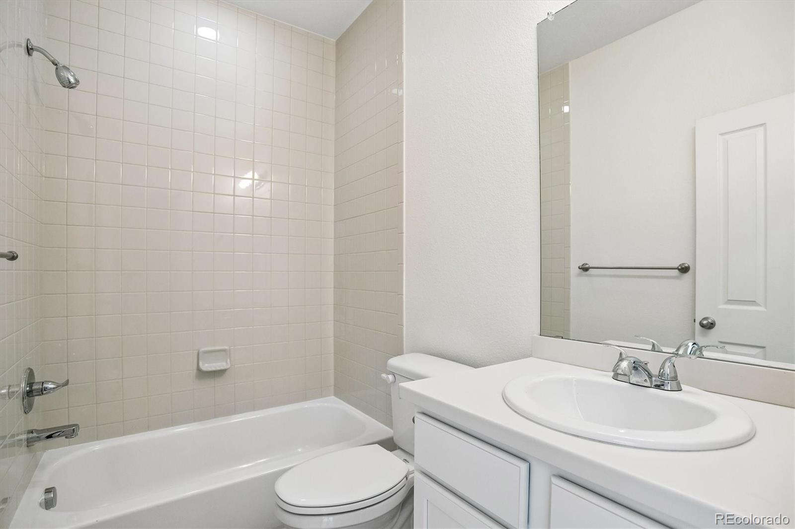 960 Fire Rock Place Colorado Springs, CO 80921 - Photo 20 of 32 a bathroom with a sink a toilet and shower
