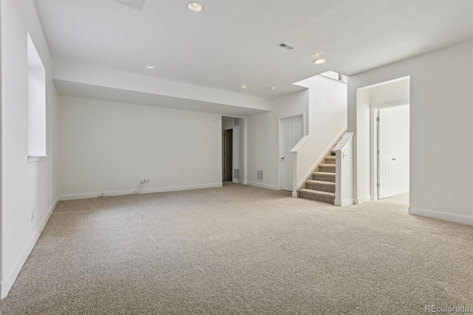 960 Fire Rock Place Colorado Springs, CO 80921 - Photo 22 of 32 a view of an empty room with stairs